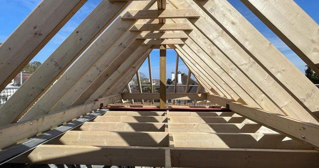 A view of a roof that is being built.