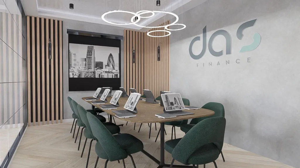 a conference room with a wooden table and green chairs